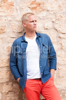 attractive young adult man standing outside