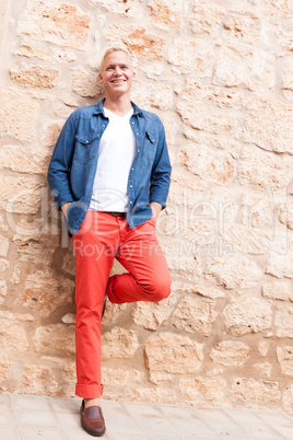 attractive young adult man standing outside