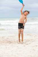 happy little child kid boy  playing beachball on beach in summer