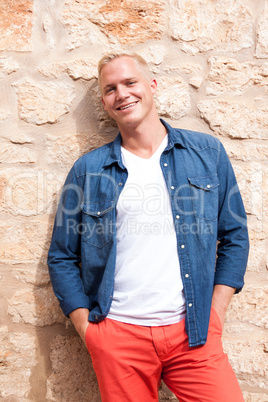 attractive young adult man standing outside