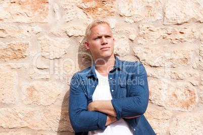 attractive young adult man standing outside