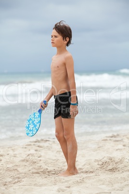 happy little child kid boy  playing beachball on beach in summer