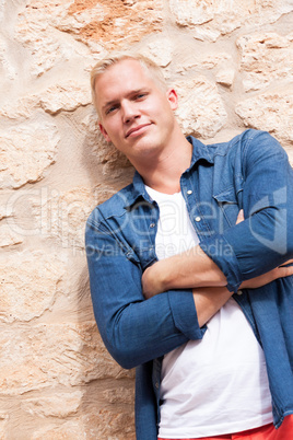 attractive young adult man standing outside