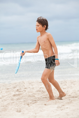 happy little child kid boy  playing beachball on beach in summer