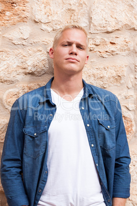 attractive young adult man standing outside