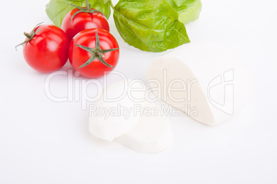 tasty tomatoe mozzarella salad with basil on white