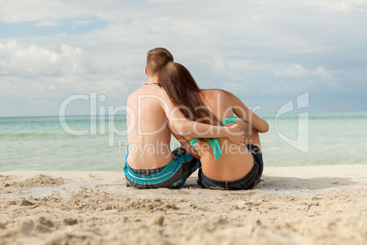 Happy young couple sunbathing