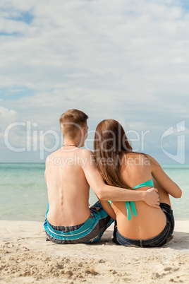 Happy young couple sunbathing