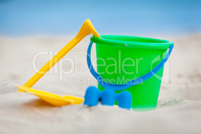 plastik colorful toys in sand on beach