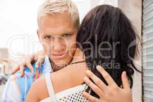 Romantic handsome man hugging his girlfriend