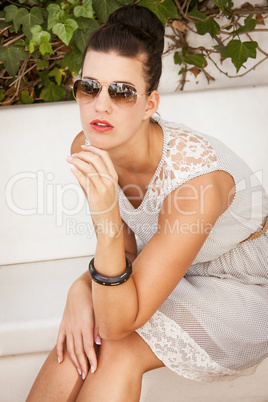 attractive brunette woman with sunglasses and red lips
