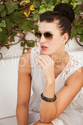 attractive brunette woman with sunglasses and red lips