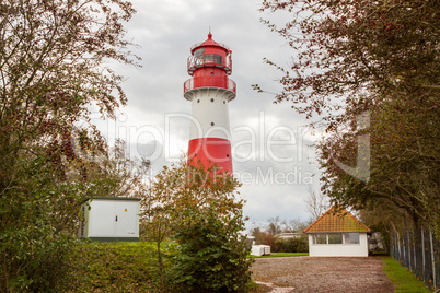 landscape baltic sea dunes lighthouse in red and white