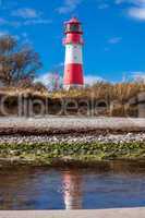 landscape baltic sea dunes lighthouse in red and white