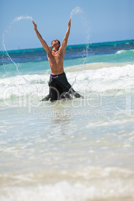 attractive careree happy man in water holiday vacation summer