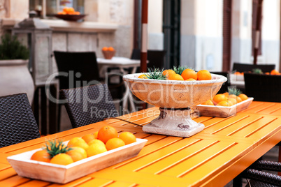 fresh orange fruits decorative on table in summer