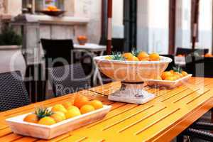 fresh orange fruits decorative on table in summer