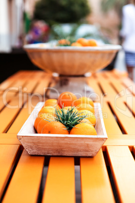 fresh orange fruits decorative on table in summer