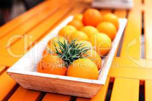 fresh orange fruits decorative on table in summer