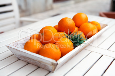 fresh orange fruits decorative on table in summer