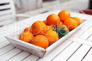 fresh orange fruits decorative on table in summer