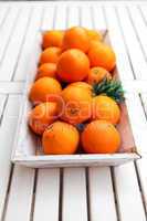 fresh orange fruits decorative on table in summer