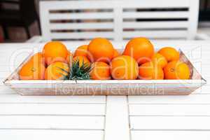 fresh orange fruits decorative on table in summer