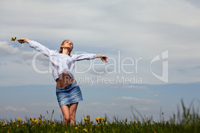 young woman is happy outdoor in summer
