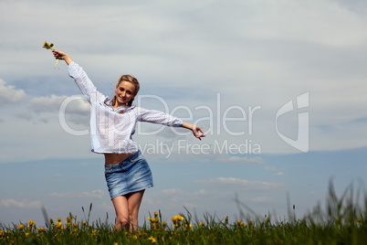 young woman is happy outdoor in summer