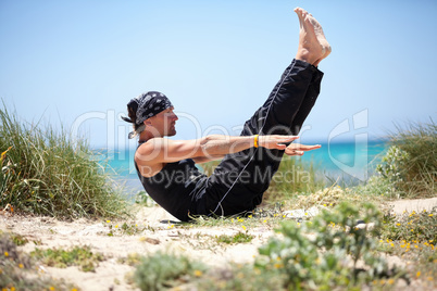 adult healthy man doing pilates yoga exercise