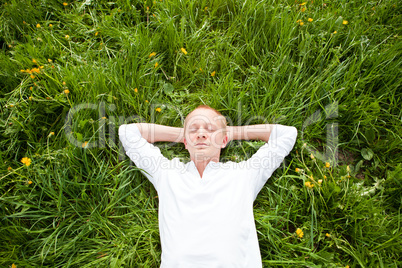 young man outdoor in summer in nature happy
