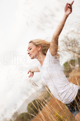 young happy attractive woman arms wide open