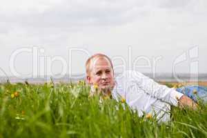young man outdoor in summer in nature happy