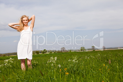 beautiful blonde woman outdoor in summer happy