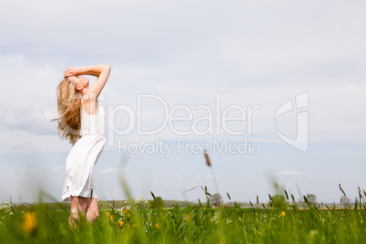 beautiful blonde woman outdoor in summer happy