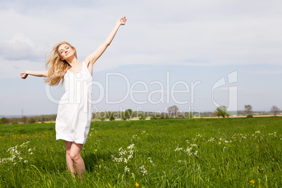 beautiful blonde woman outdoor in summer happy