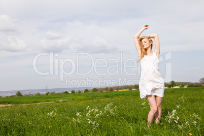 beautiful blonde woman outdoor in summer happy