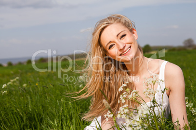 beautiful blonde woman outdoor in summer happy