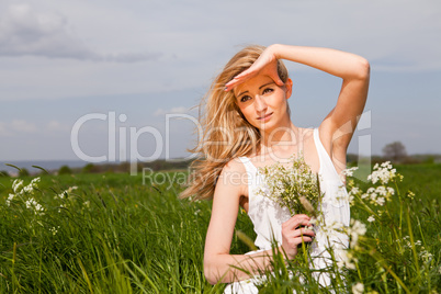 beautiful blonde woman outdoor in summer happy