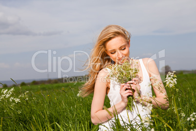 beautiful blonde woman outdoor in summer happy