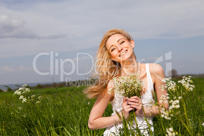 beautiful blonde woman outdoor in summer happy