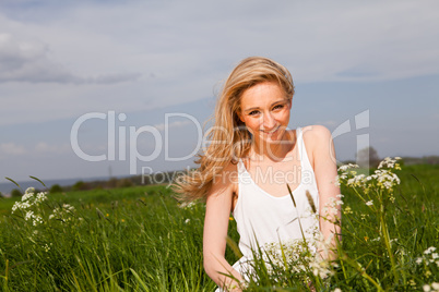 beautiful blonde woman outdoor in summer happy