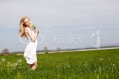 beautiful blonde woman outdoor in summer happy