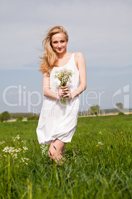 beautiful blonde woman outdoor in summer happy