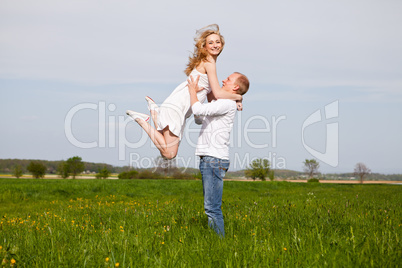 young happy couple have fun in summer