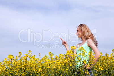 beautiful blonde girl in a field in summer