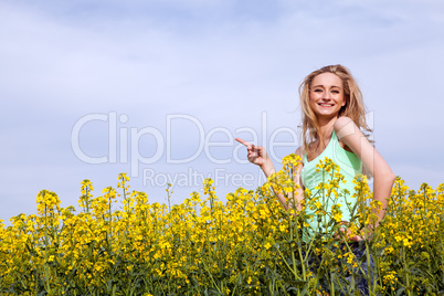 beautiful blonde girl in a field in summer