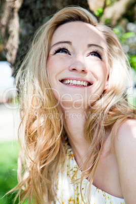 beautiful young girl happy in summer outdoor