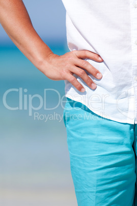 young man walking on the beach in holiday