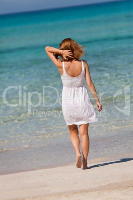beautiful happy woman on the beach lifestyle summertime